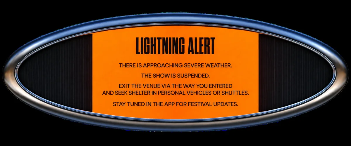 Front chest print: chrome oval with orange Lightning Alert screen